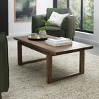 Dark oak Bentley Designs coffee table with wire brushed finish, featuring a sleek, modern wooden surface and sturdy legs.