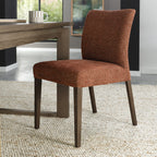 Pair of Auburn brown fabric dining chairs with dark oak legs from Bentley Designs, showcasing elegant upholstery and sturdy wooden frames.