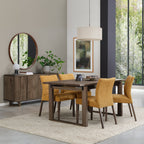 Pair of mustard yellow fabric dining chairs with dark oak legs by Bentley Designs, showcasing stylish and comfortable seating.
