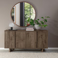 Dark oak Bentley Designs 4-door wide sideboard with two shelves, showcasing a sleek, modern storage piece with ample space.