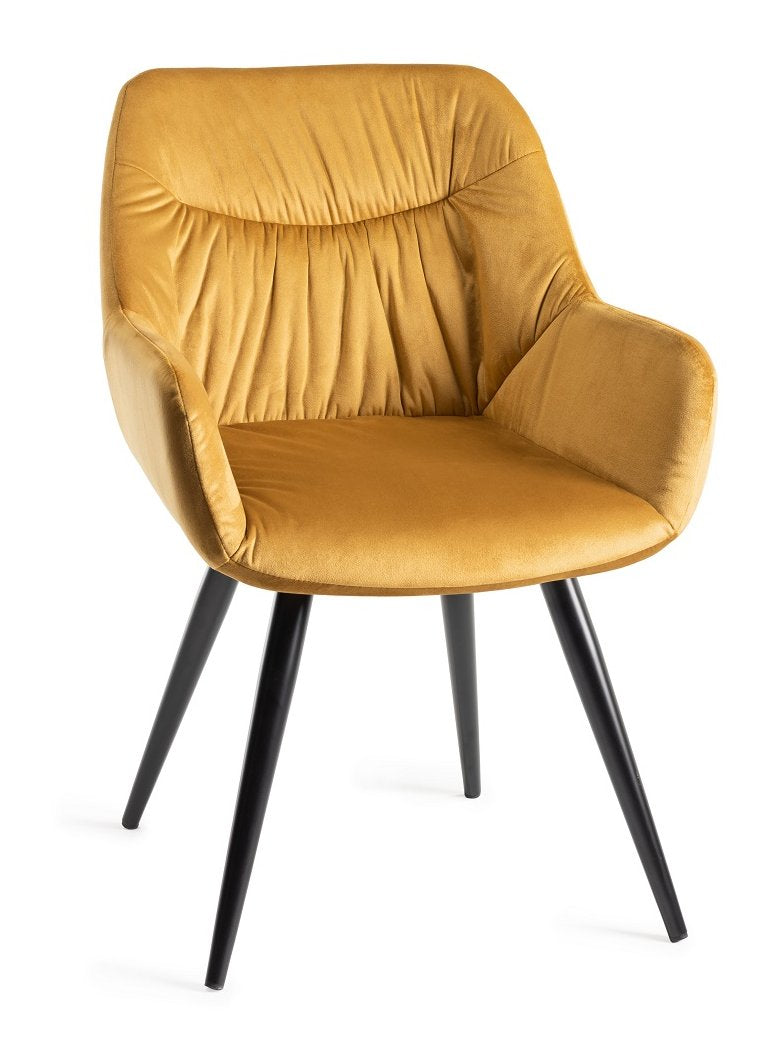 Yellow velvet fabric Bentley Designs dining arm chair with pleated back and patterned upholstery.