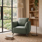 Green leather back armchair with cushion, nickel legs, from Bentley Designs, featuring a stylish lounge chair with comfortable padding.
