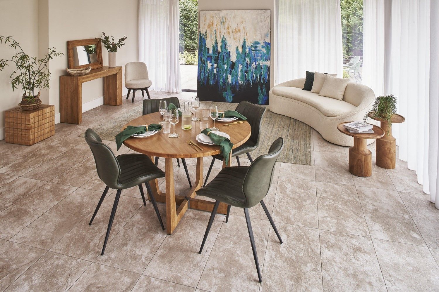 Modern living room with a dining table set and a sofa.