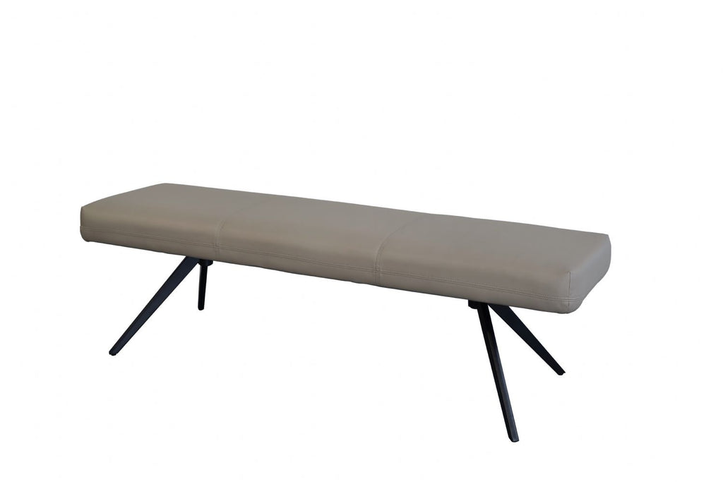 Beige bench with black metal legs on a white background